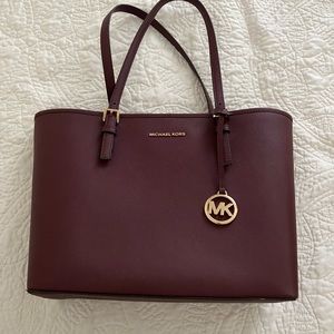 Plum colored Michael Kors tote bag